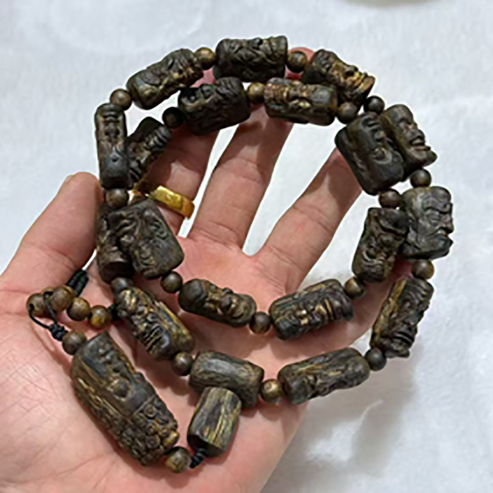 masterpiece kynam agarwood "18 arhats" hand carved multi wrap bracelet 55g masterpiece kynam agarwood "18 arhats" hand carved multi wrap bracelet 55g